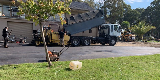 This is a photo of an asphalt driveway which is in the process of being installed by Orange Road Tek